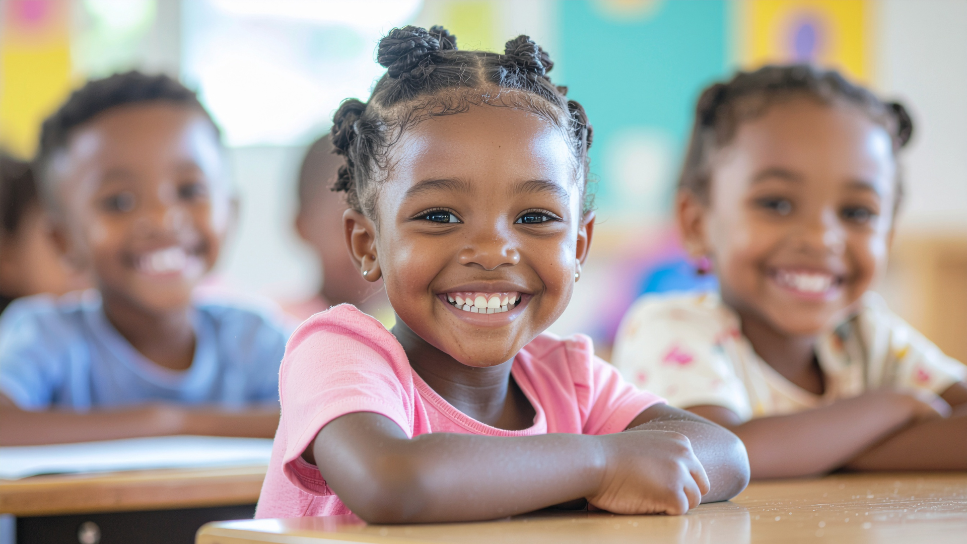 Smiling preschool students at their desks